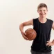 Coach helping build self-confidence in children with special needs through adaptive basketball practice